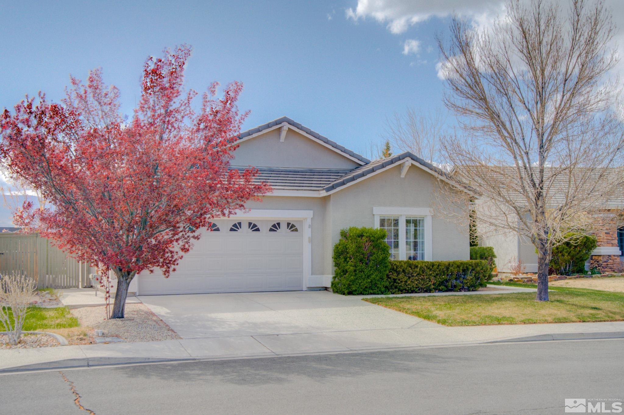 1625 Canyonlands Way Reno, NV 89521 - Photo 1 of 31 a view of a house with a yard and large tree
