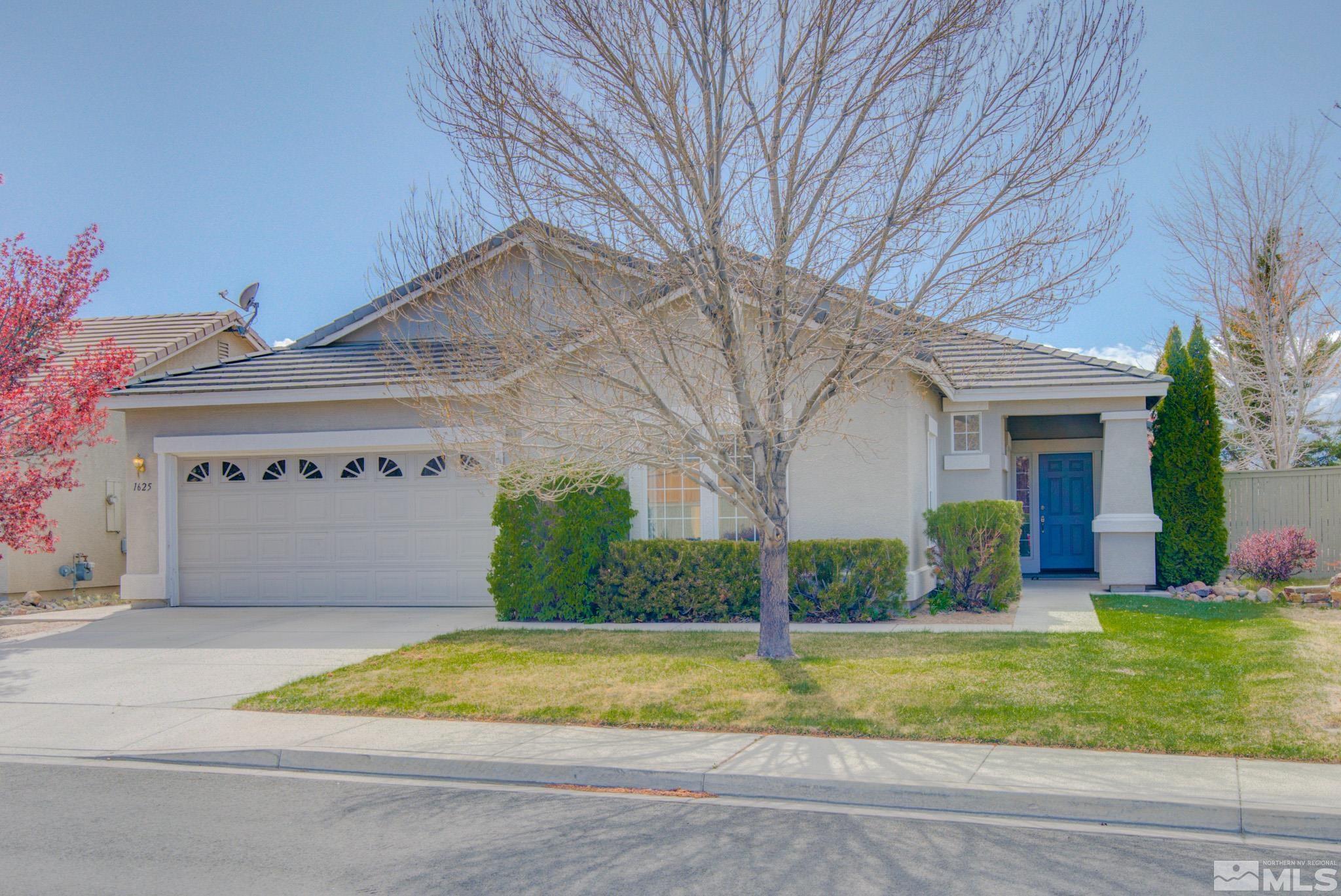 1625 Canyonlands Way Reno, NV 89521 - Photo 2 of 31 a view of a house with a yard and plants