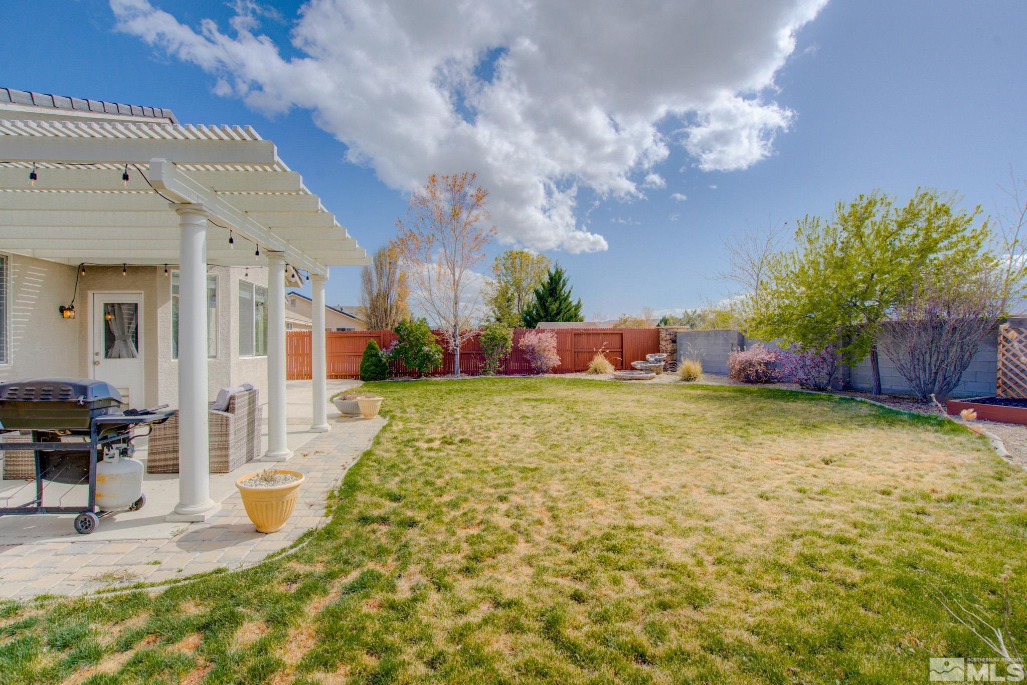 1625 Canyonlands Way Reno, NV 89521 - Photo 25 of 31 a swimming pool with outdoor seating and yard