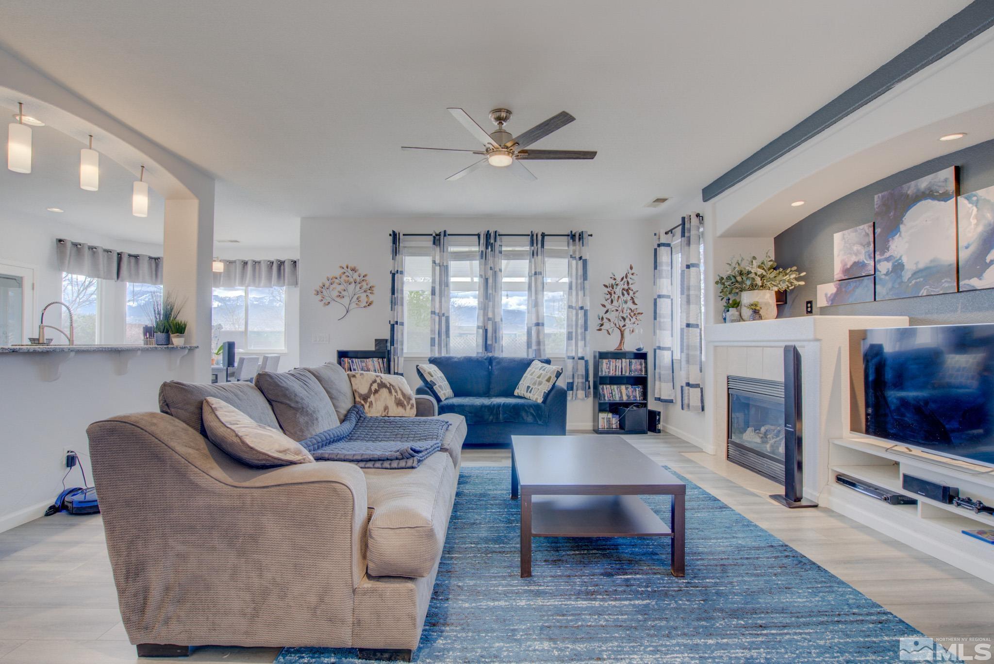 1625 Canyonlands Way Reno, NV 89521 - Photo 5 of 31 a living room with fireplace furniture and a wooden floor