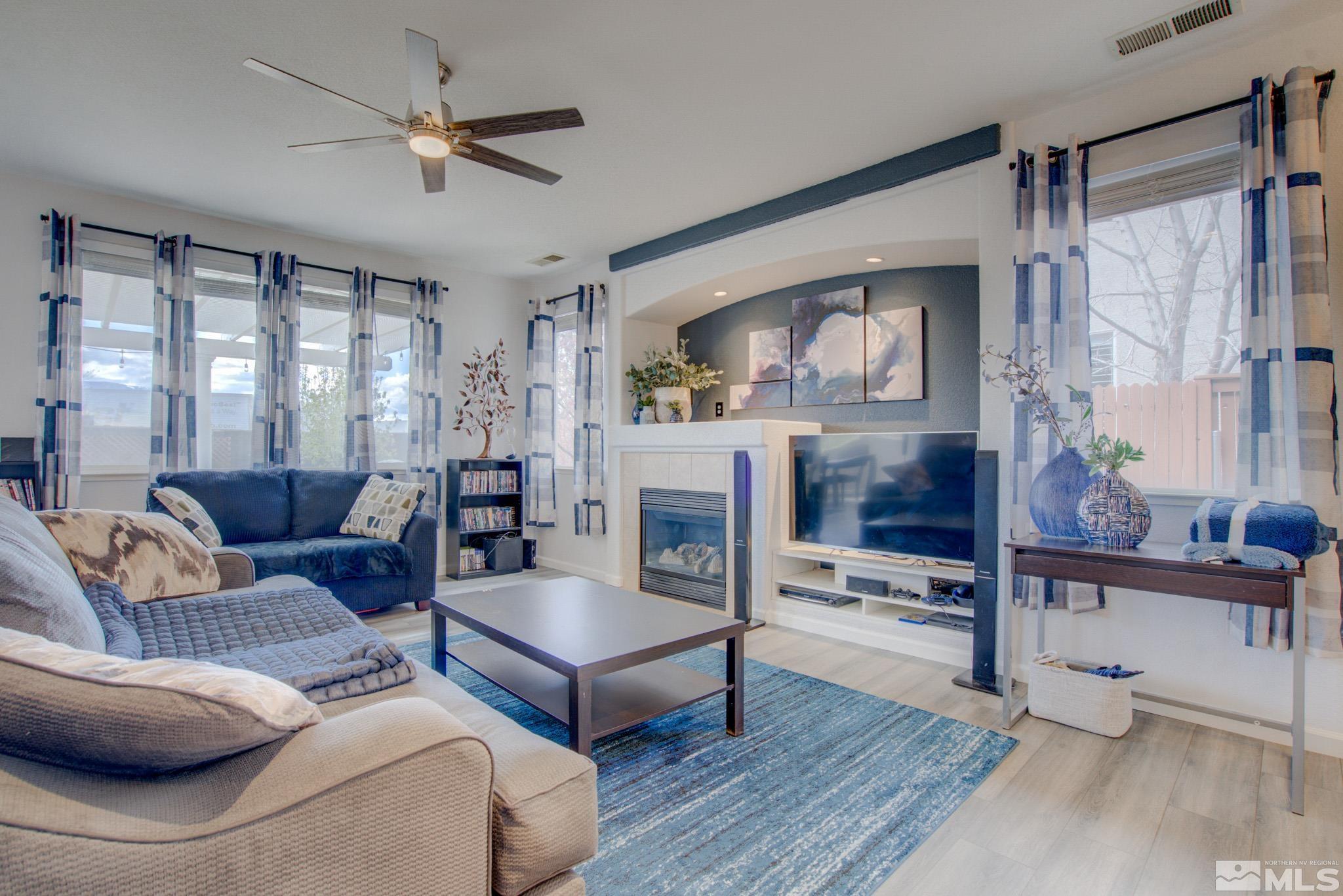 1625 Canyonlands Way Reno, NV 89521 - Photo 6 of 31 a living room with furniture and a large window