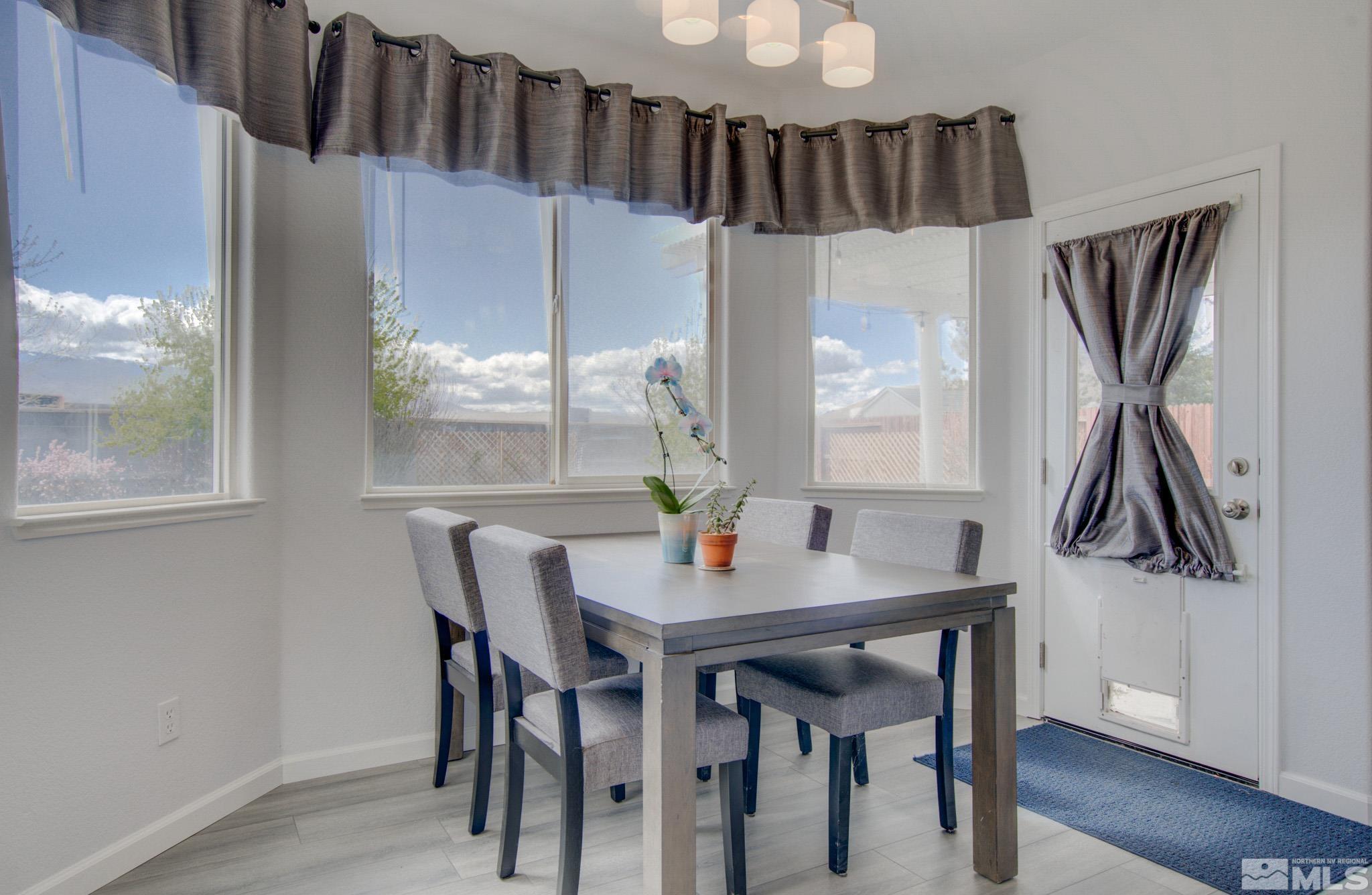 1625 Canyonlands Way Reno, NV 89521 - Photo 8 of 31 a view of a dining room with furniture and wooden floor