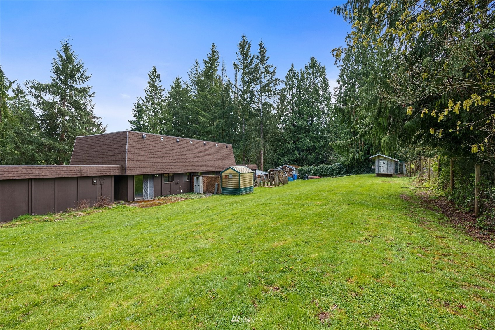 168 Chilvers Road, Unit L & M Chehalis, WA 98532 - Photo 19 of 38 a view of a house with a yard and sitting area