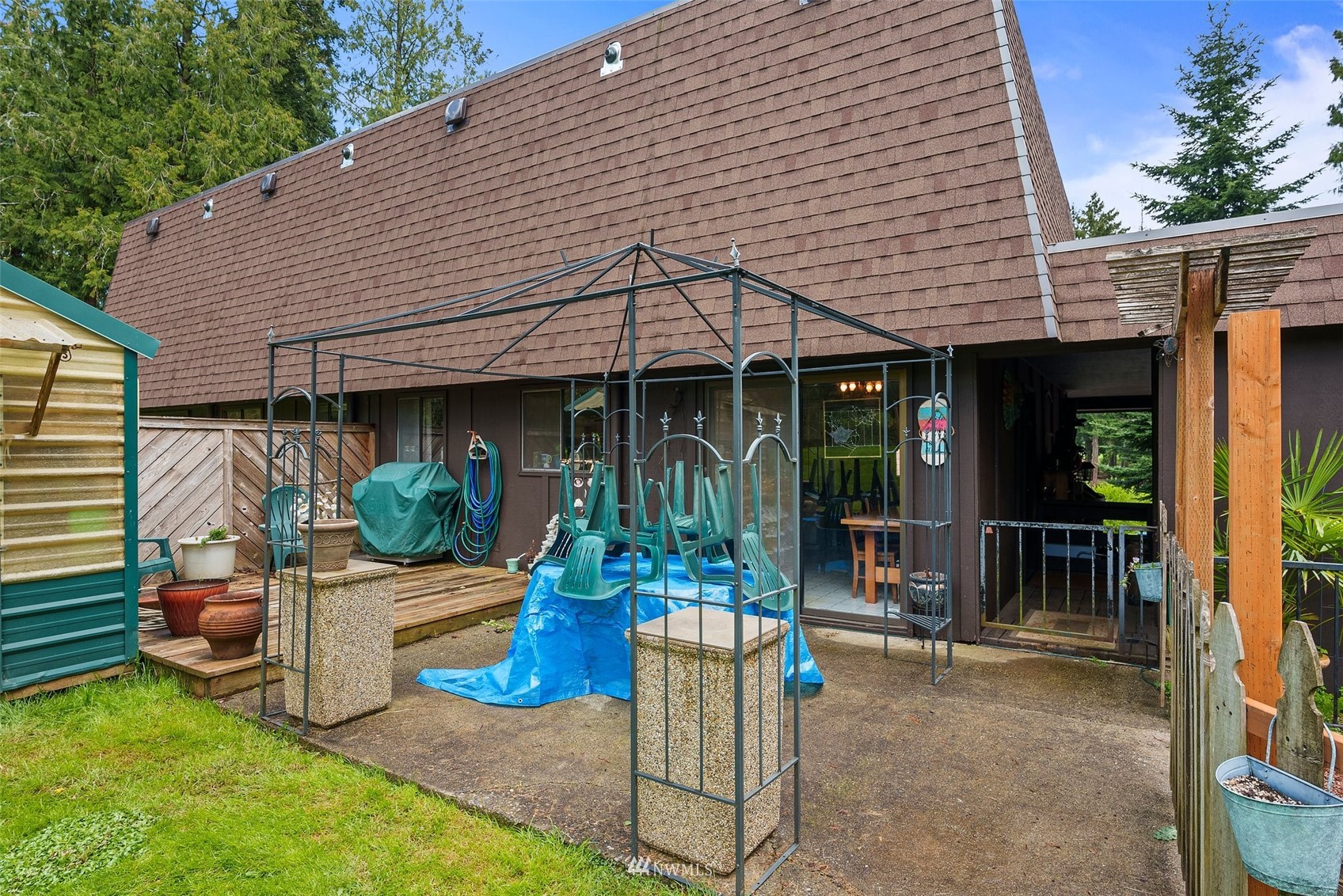 168 Chilvers Road, Unit L & M Chehalis, WA 98532 - Photo 33 of 38 a view of a house with backyard porch and sitting area