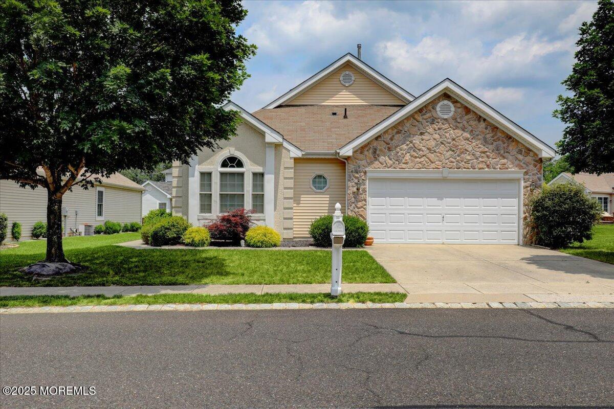 4 Long Bay Road Jackson, NJ 08527 - Photo 1 of 48 a front view of a house with a yard and garage