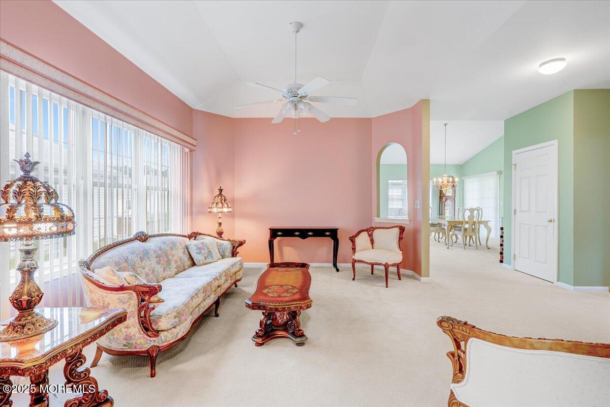 4 Long Bay Road Jackson, NJ 08527 - Photo 11 of 48 a living room with furniture and a chandelier