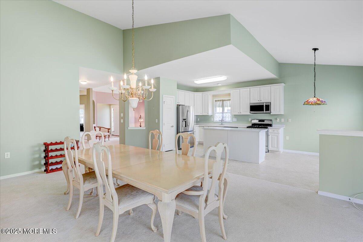 4 Long Bay Road Jackson, NJ 08527 - Photo 17 of 48 a dining room with furniture and kitchen view