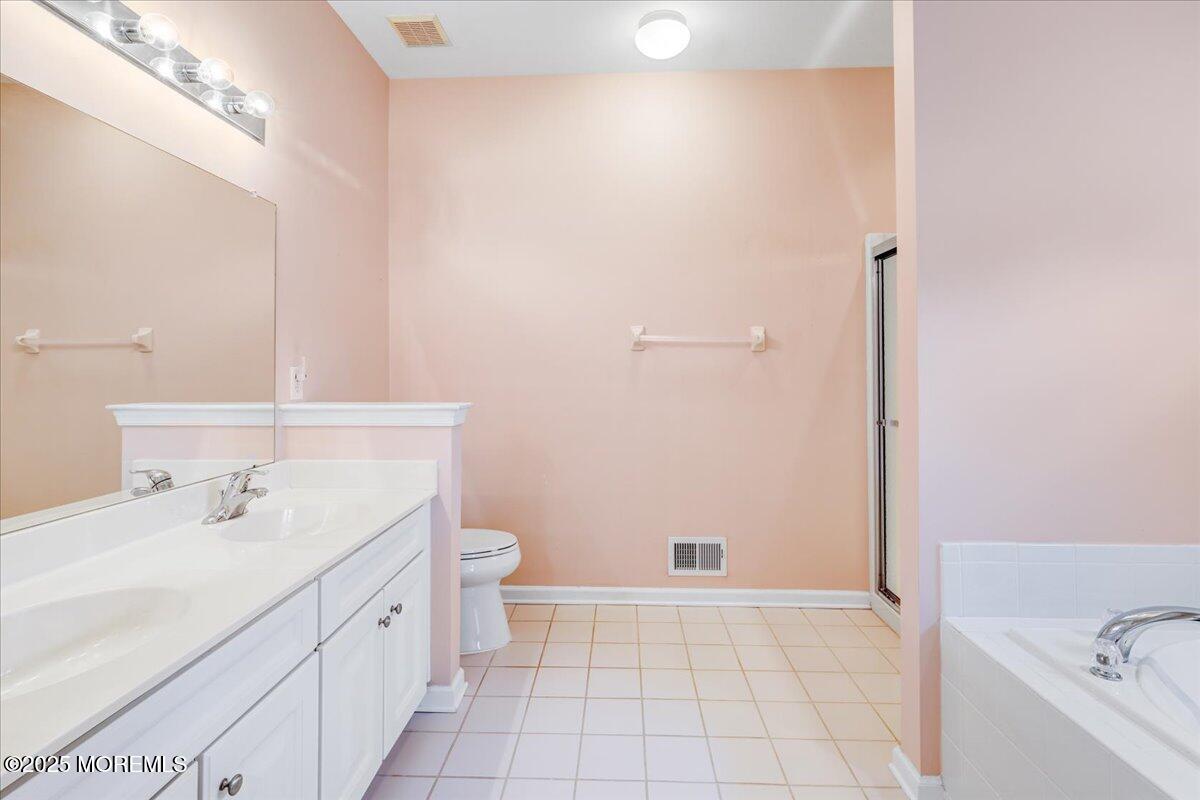 4 Long Bay Road Jackson, NJ 08527 - Photo 23 of 48 a bathroom with a tub sink and mirror