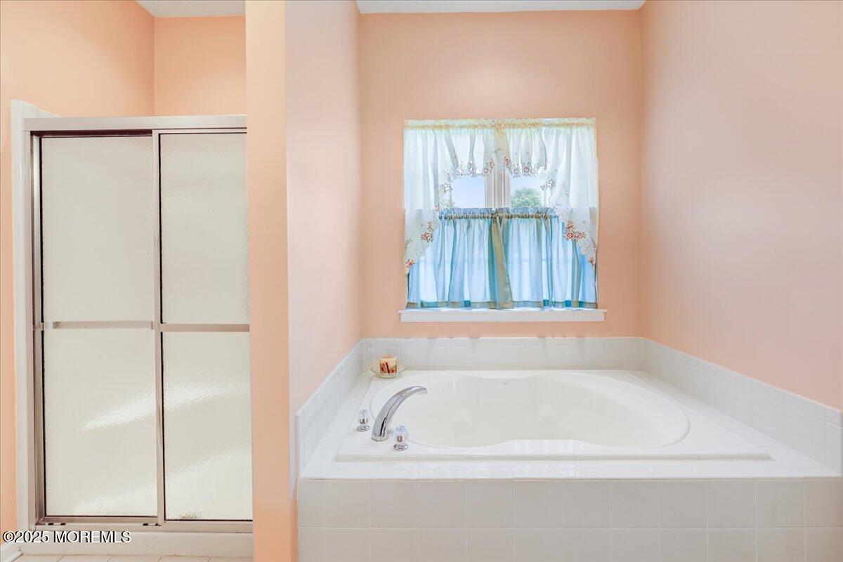 4 Long Bay Road Jackson, NJ 08527 - Photo 24 of 48 a white bath tub sitting next to a window