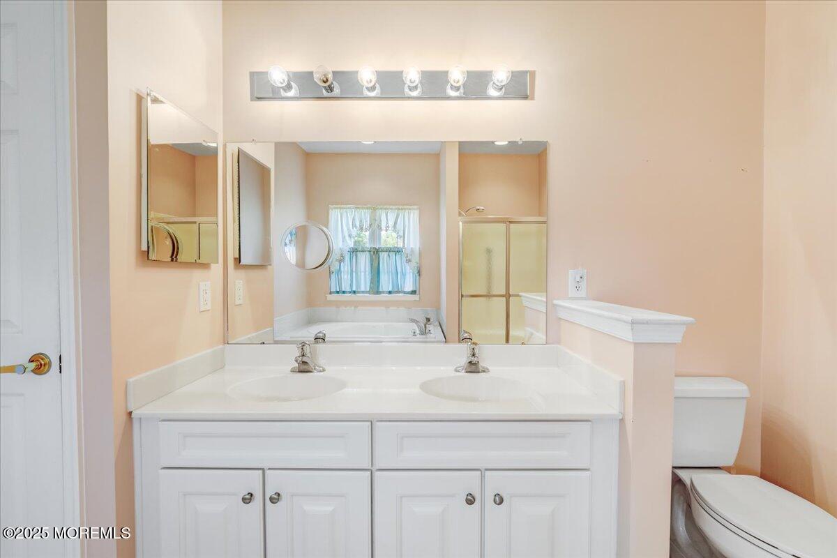 4 Long Bay Road Jackson, NJ 08527 - Photo 25 of 48 a bathroom with a sink and a mirror