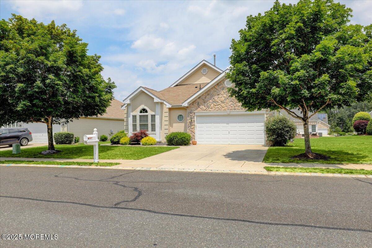 4 Long Bay Road Jackson, NJ 08527 - Photo 3 of 48 a house with a yard and a large parking space