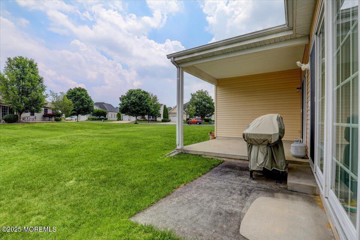 4 Long Bay Road Jackson, NJ 08527 - Photo 32 of 48 a view of a porch with a table and a chairs