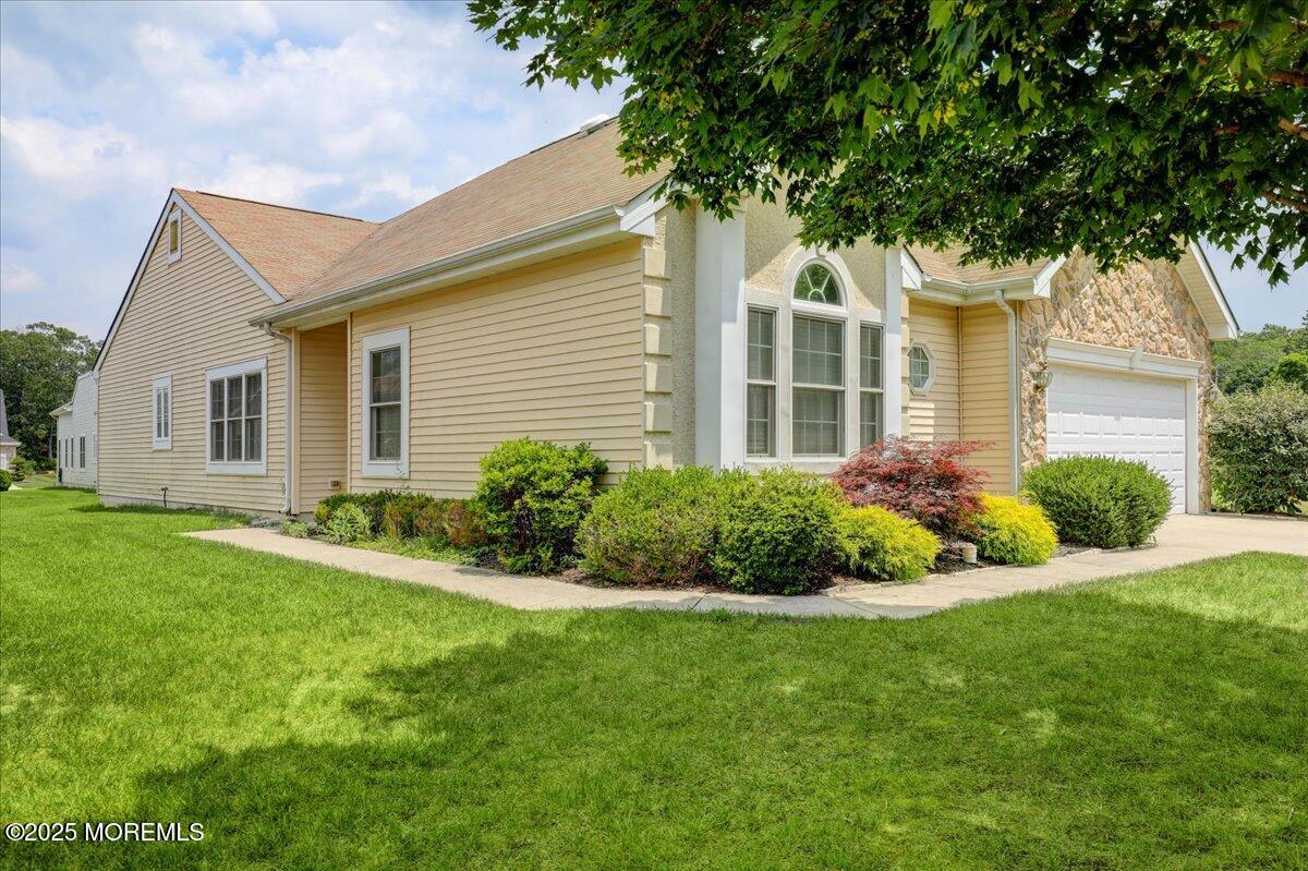 4 Long Bay Road Jackson, NJ 08527 - Photo 5 of 48 a front view of a house with a yard and potted plants