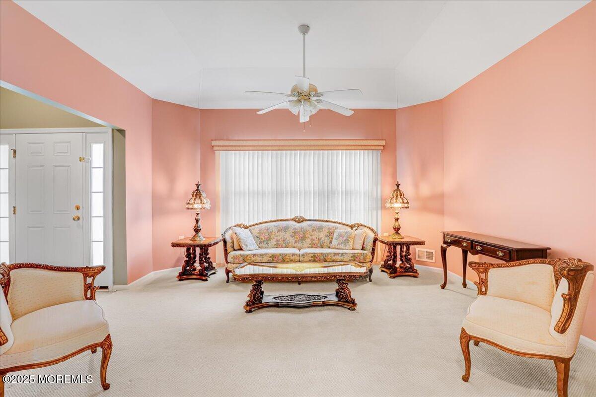 4 Long Bay Road Jackson, NJ 08527 - Photo 10 of 48 a living room with furniture a window and a chandelier