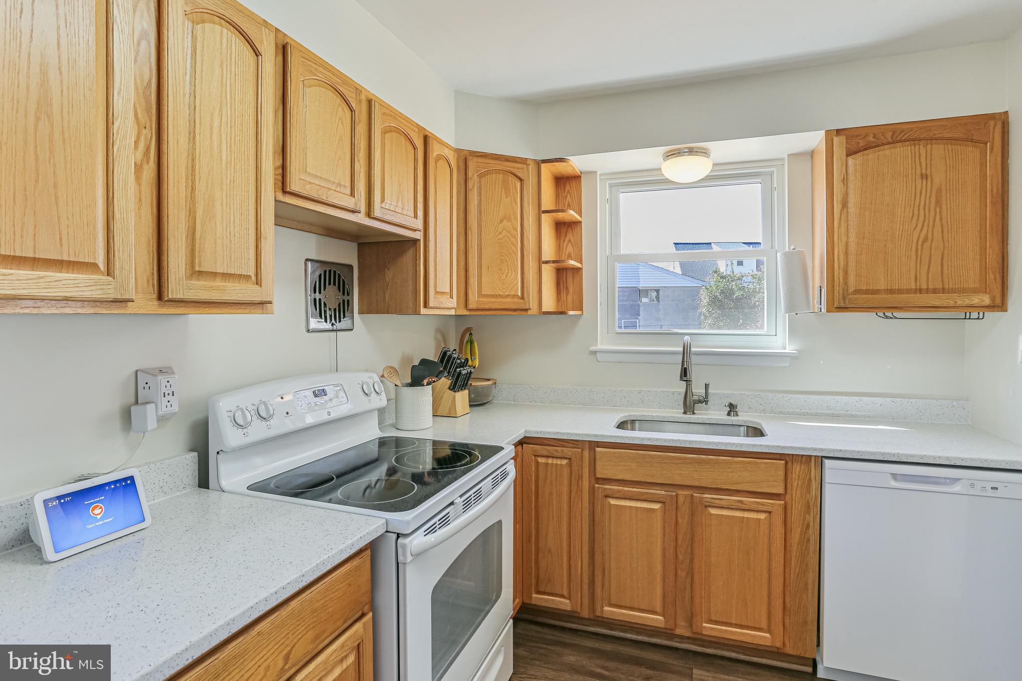 12702 Goodhill Road Silver Spring, MD 20906 - Photo 11 of 28 a kitchen with stainless steel appliances granite countertop a sink stove and cabinets