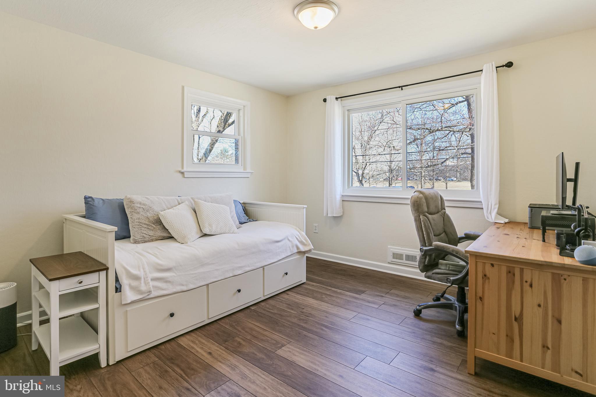 12702 Goodhill Road Silver Spring, MD 20906 - Photo 18 of 28 a room with a bed and a desk