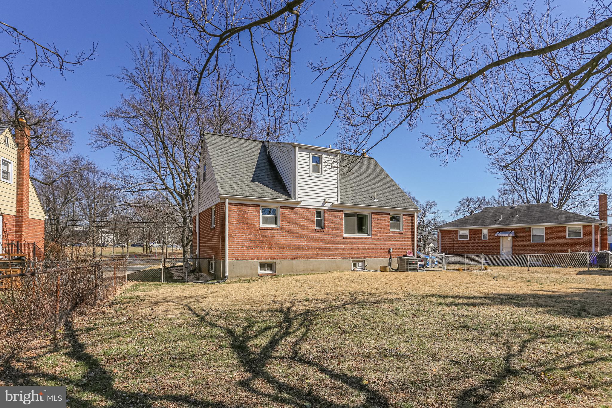 12702 Goodhill Road Silver Spring, MD 20906 - Photo 27 of 28 a front view of a building with a yard