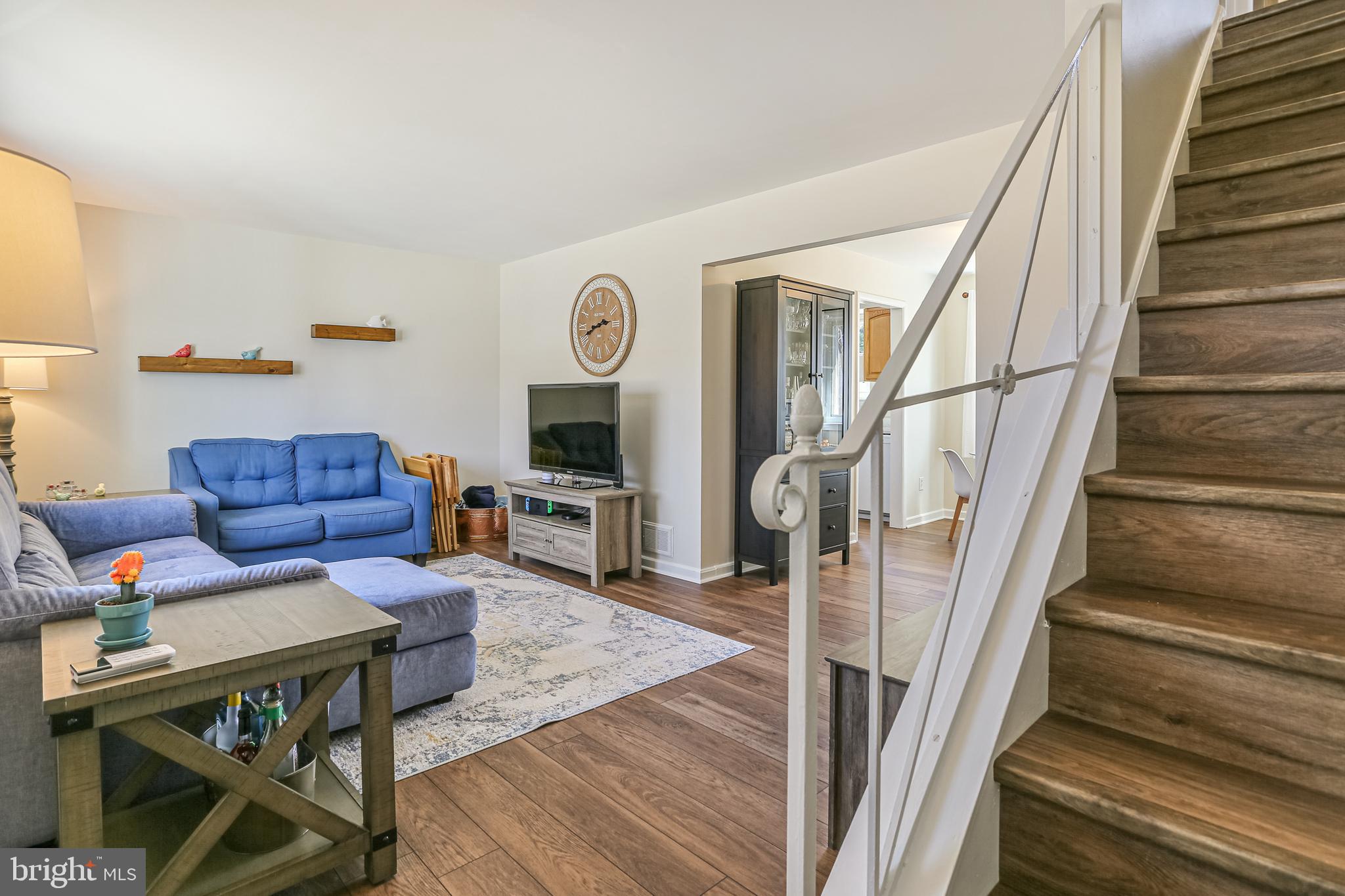 12702 Goodhill Road Silver Spring, MD 20906 - Photo 4 of 28 a living room with furniture and a wooden floor
