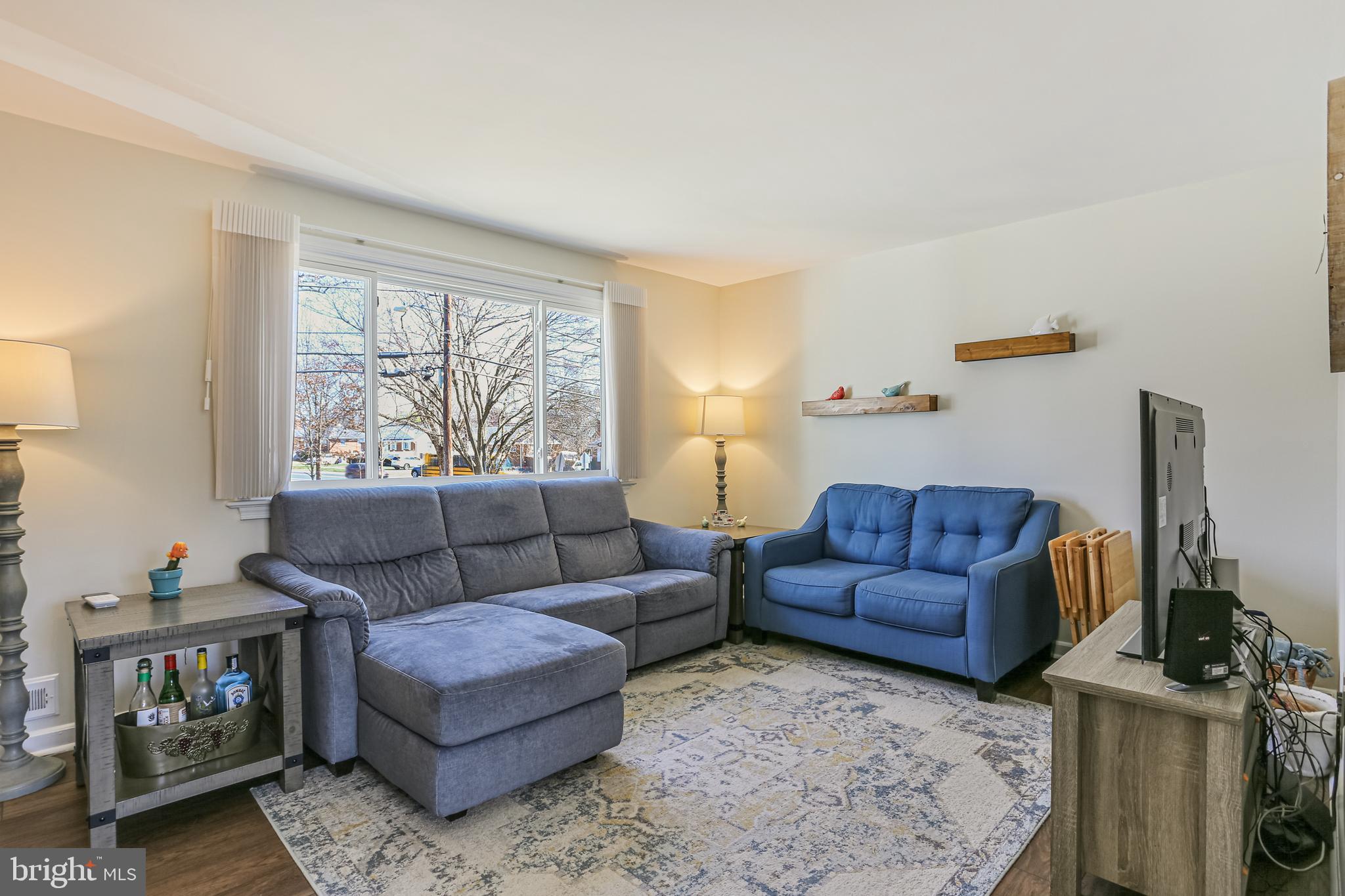 12702 Goodhill Road Silver Spring, MD 20906 - Photo 5 of 28 a living room with furniture a rug and a window