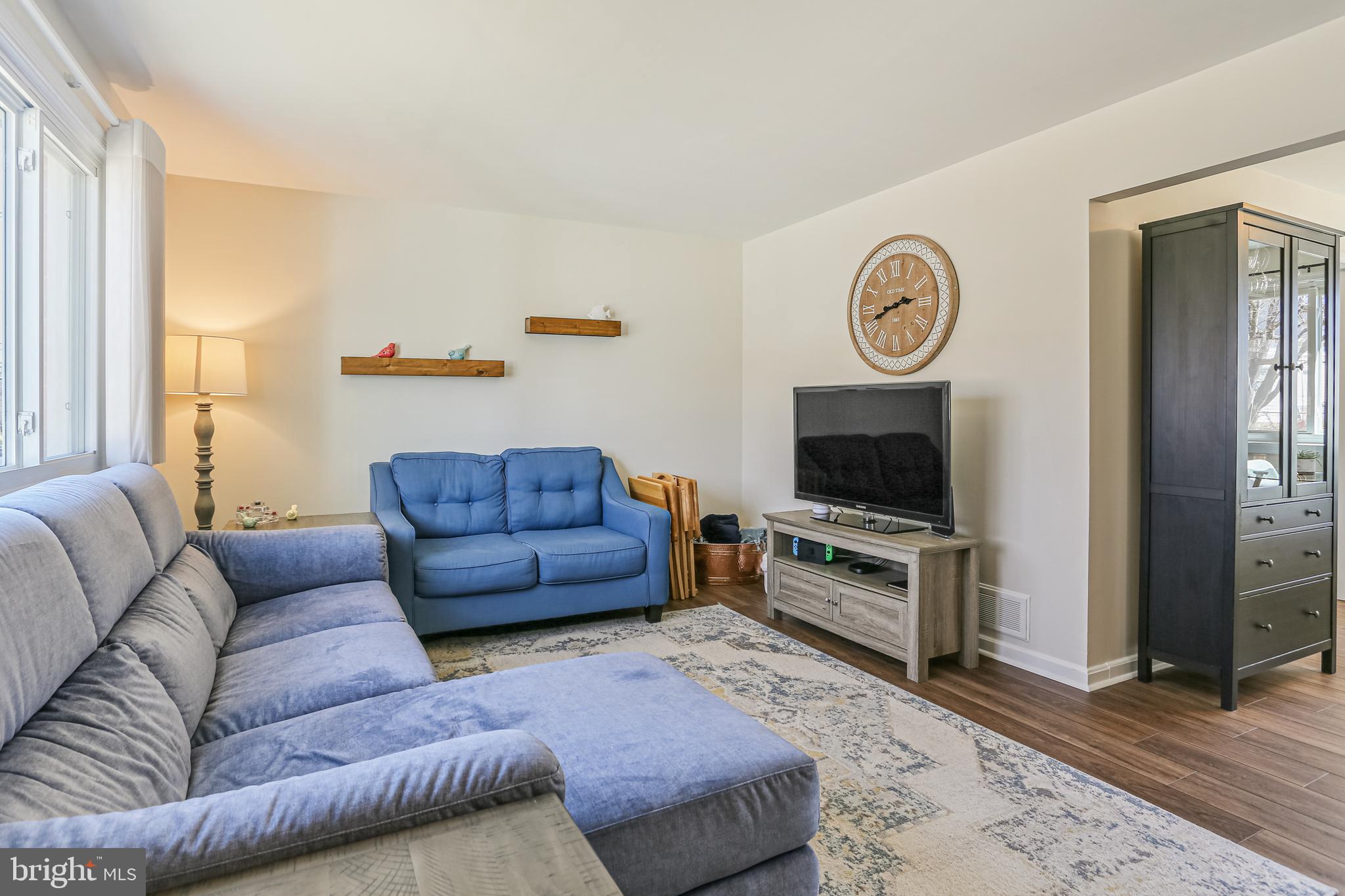 12702 Goodhill Road Silver Spring, MD 20906 - Photo 6 of 28 a living room with furniture and a flat screen tv