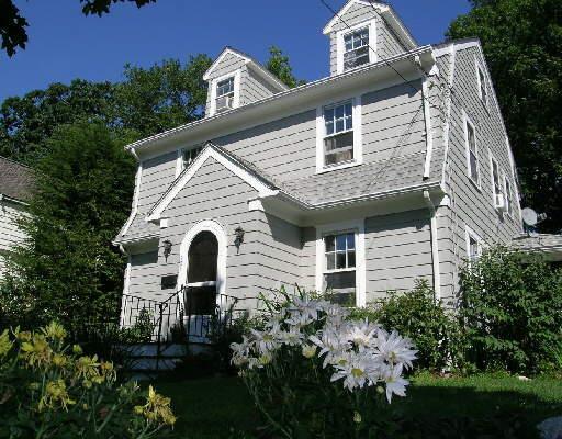 101 Woodmere Road Stamford, CT 06905 - Photo 1 of 1 a front view of a house with plants