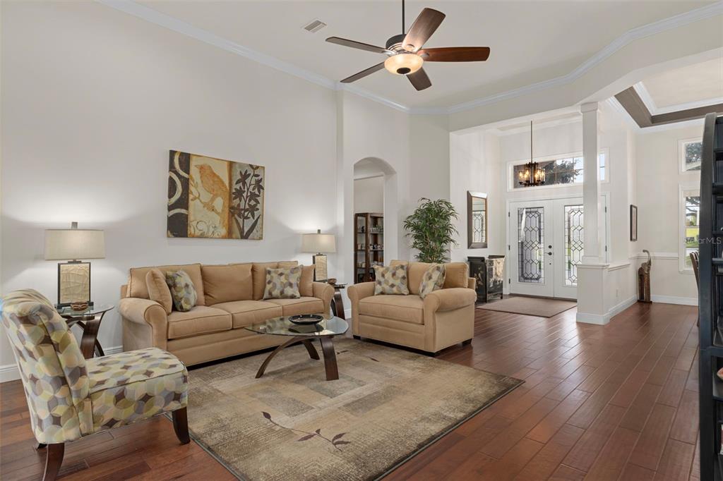 1601 North Tee Time Terrace Hernando, FL 34442 - Photo 17 of 69 a living room with furniture and a chandelier