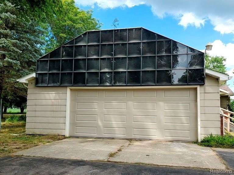 8423 North Jennings Road Mount Morris, MI 48458 - Photo 3 of 44 2 car attached garage has solar panels