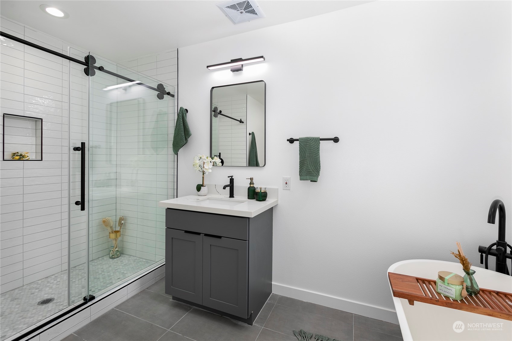 4007 Midvale Avenue North Seattle, WA 98103 - Photo 18 of 33 a bathroom with a granite countertop sink toilet and shower