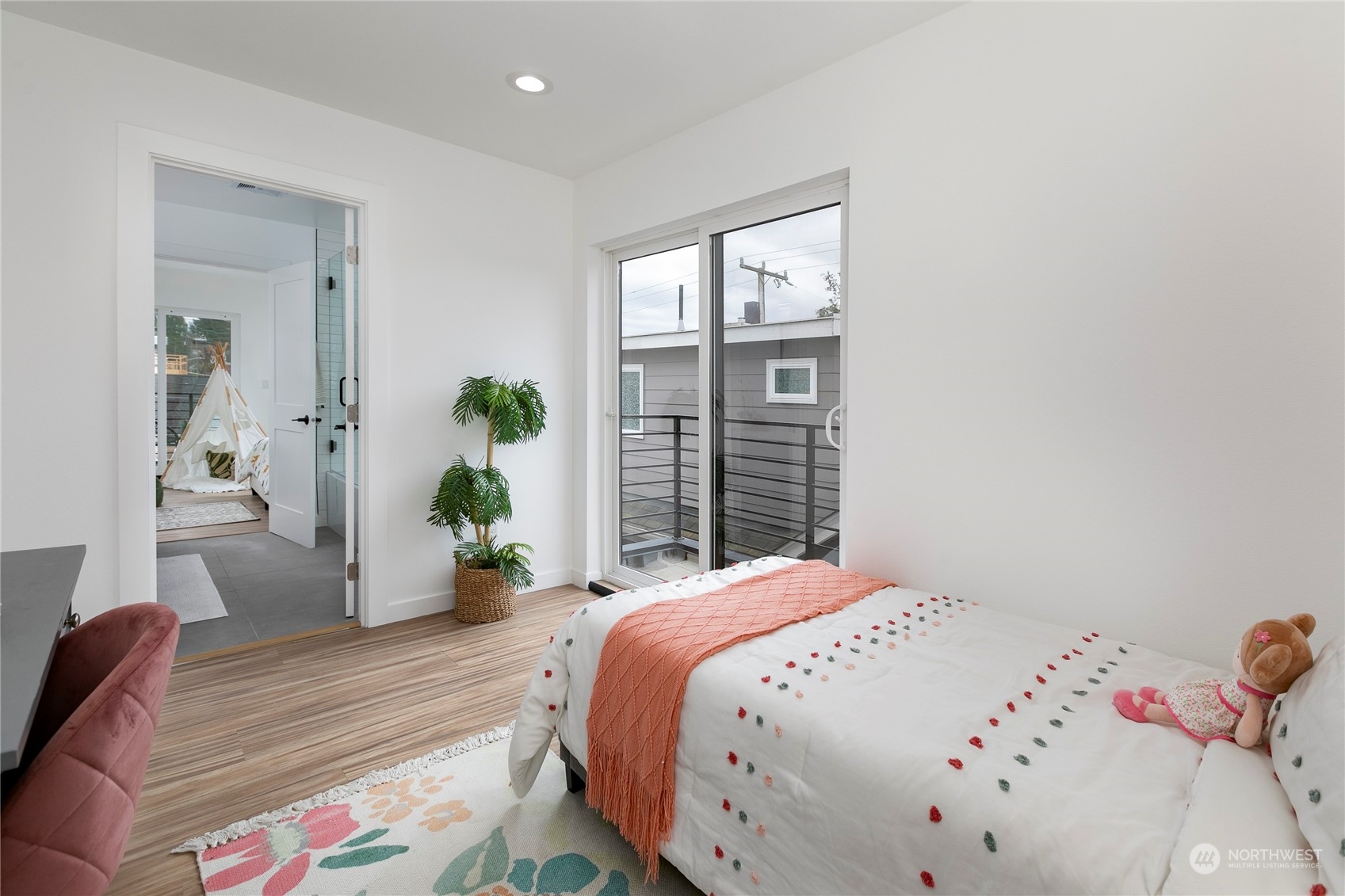 4007 Midvale Avenue North Seattle, WA 98103 - Photo 20 of 33 a bedroom with a bed and wooden floor