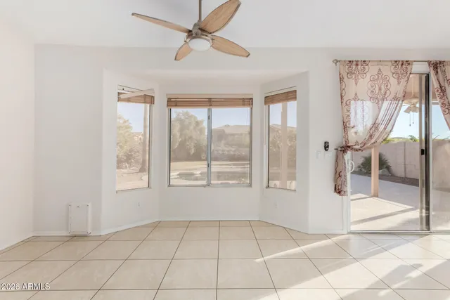 a view of a small space with wooden floor and a window