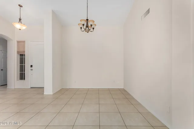 a kitchen with stainless steel appliances granite countertop a refrigerator and a stove