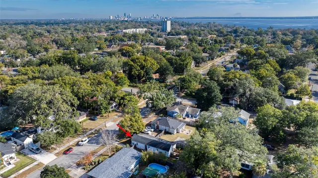 an aerial view of a house with a yard