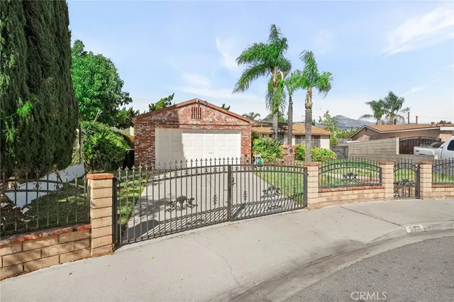 a view of a wrought iron fences in front of house