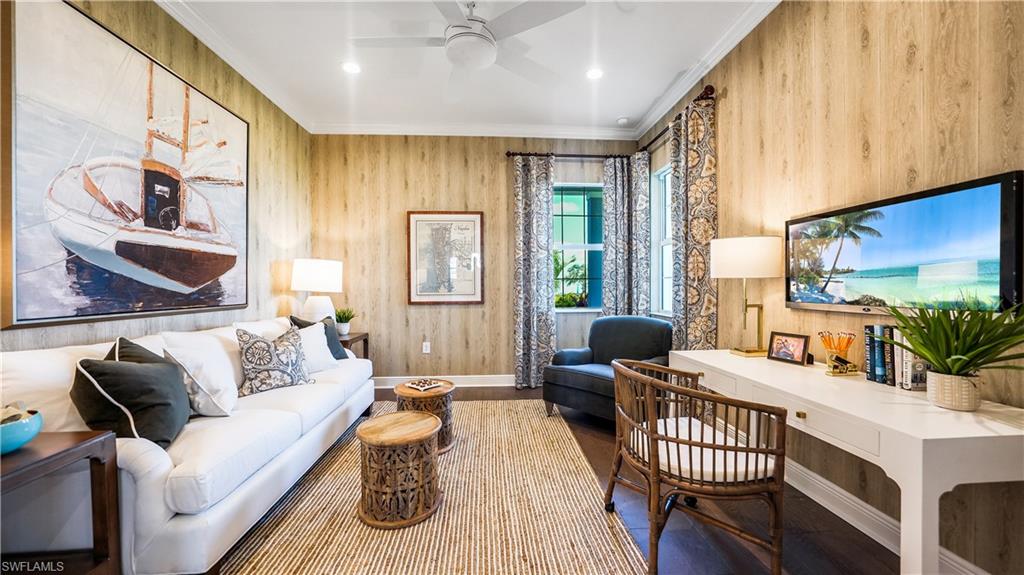 3992 Skysail Drive Naples, FL 34120 - Photo 9 of 12 a living room with furniture and a large window