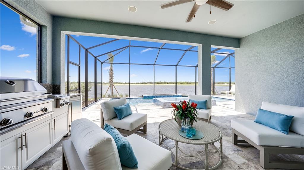 3992 Skysail Drive Naples, FL 34120 - Photo 10 of 12 a living room with furniture and a large window
