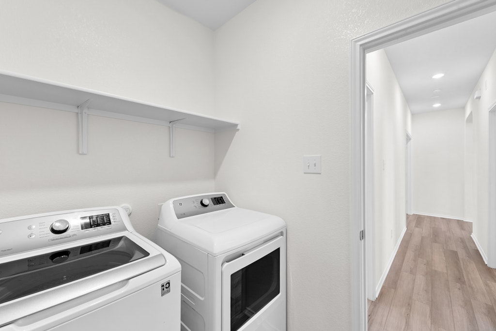 438 Thunder Valley Trail Georgetown, TX 78626 - Photo 16 of 21 a utility room with dryer and washer