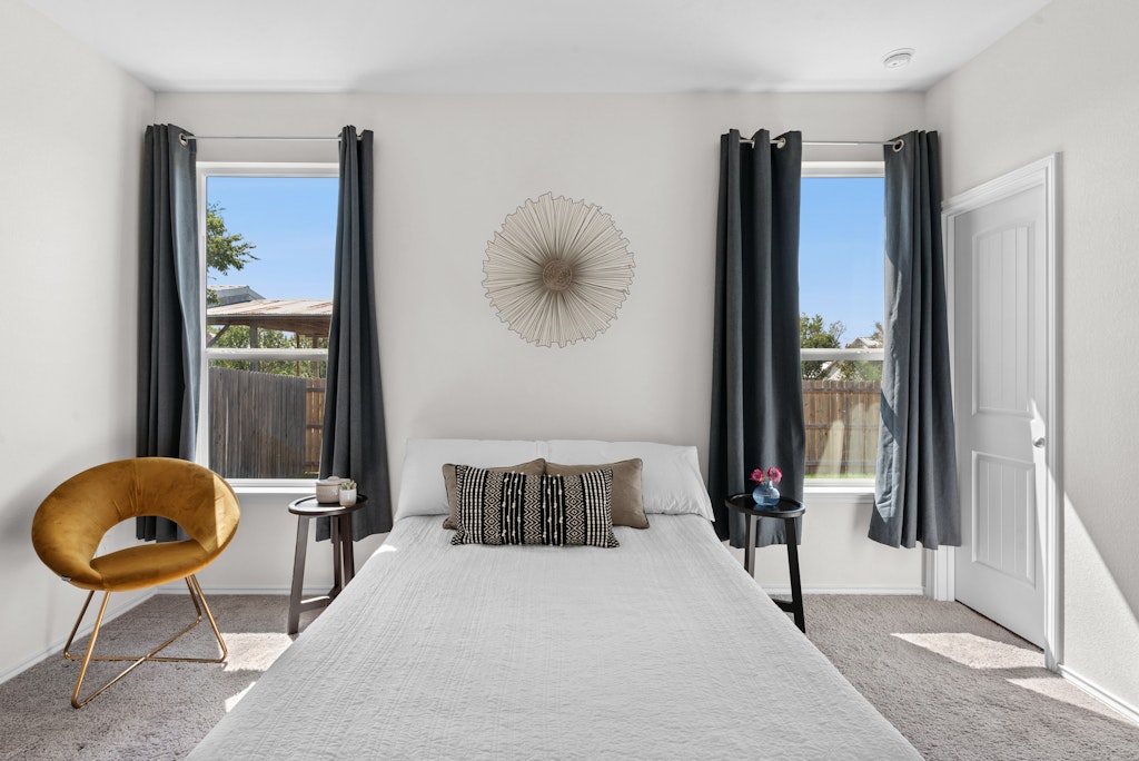 438 Thunder Valley Trail Georgetown, TX 78626 - Photo 8 of 21 a bedroom with a bed and a mirror