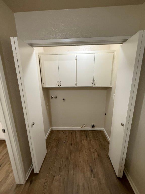 1405 East Cypress Avenue Reedley, CA 93654 - Photo 14 of 29 a view of storage and utility room with wooden floor