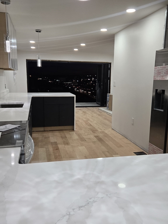 47 Laurel Street Worcester, MA 01605 - Photo 17 of 25 a view of a lobby with a couch and a fireplace