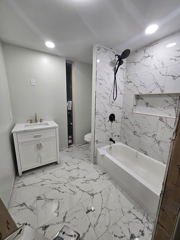 47 Laurel Street Worcester, MA 01605 - Photo 20 of 25 a bathroom with a bathtub sink and toilet