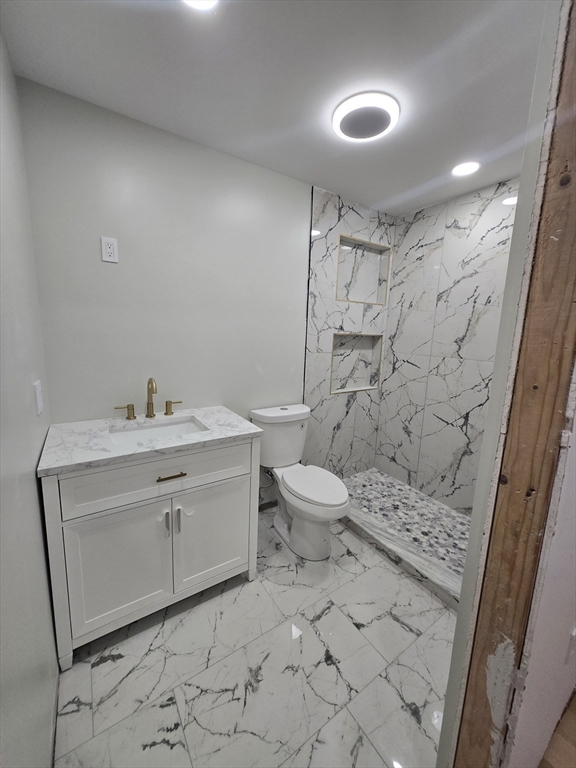 47 Laurel Street Worcester, MA 01605 - Photo 21 of 25 a bathroom with a sink toilet and shower