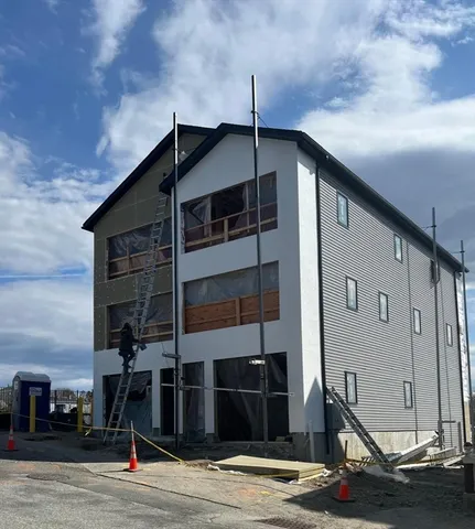 a front view of a house with street