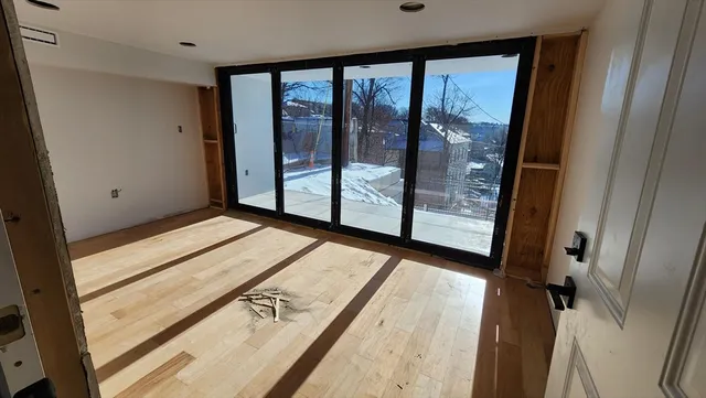 a view of an empty room with windows