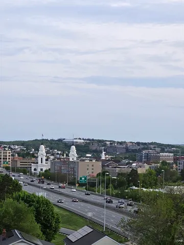 an aerial view of a city with lots of buildings