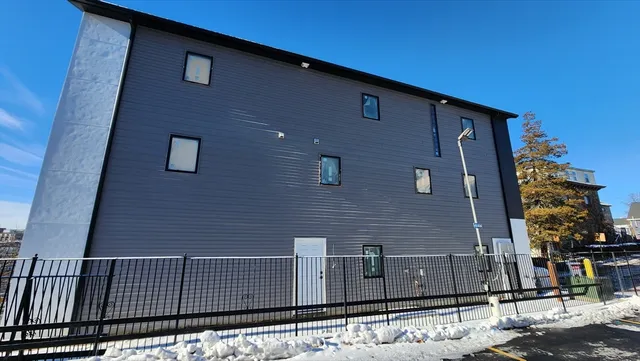 a bedroom with a bed and gym equipment