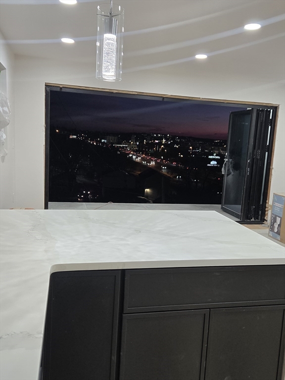 47 Laurel Street Worcester, MA 01605 - Photo 6 of 25 a bathroom with a sink a vanity and a mirror