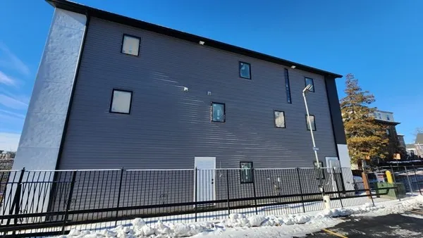 wooden floor in an empty room with a fireplace
