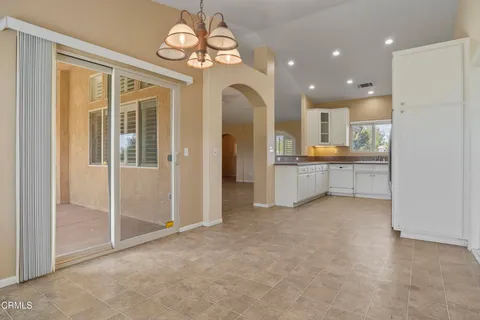 a view of a livingroom with a kitchen
