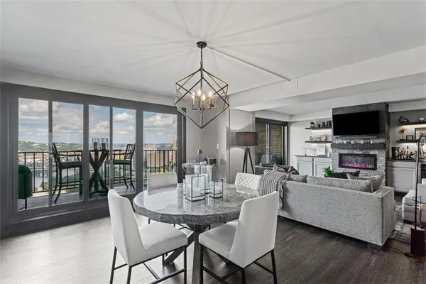 a view of a dining room with furniture window and wooden floor