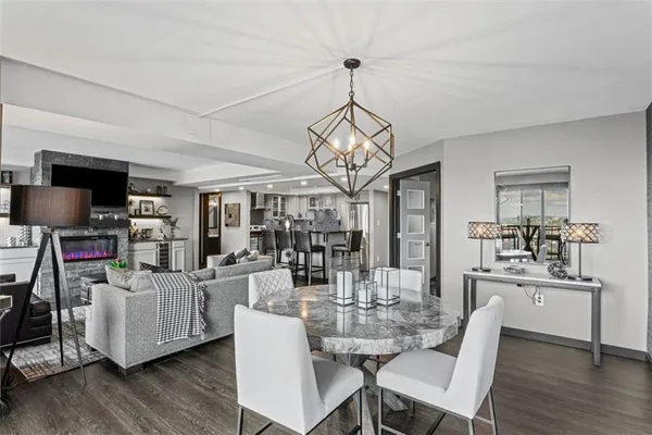 a view of a dining room with furniture wooden floor and chandelier